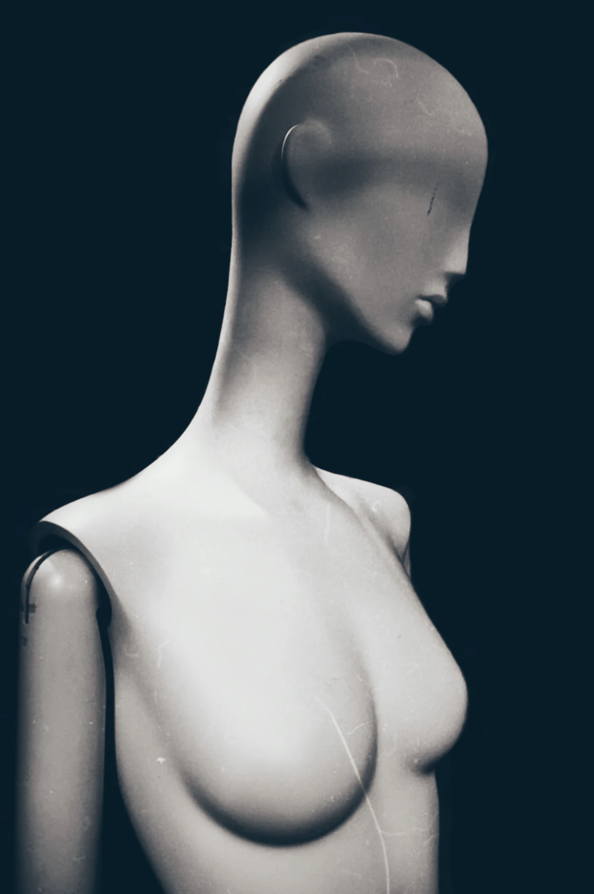 A white mannequin figure against a black background (representative image, not the actual Panoptikum wax museum interior)