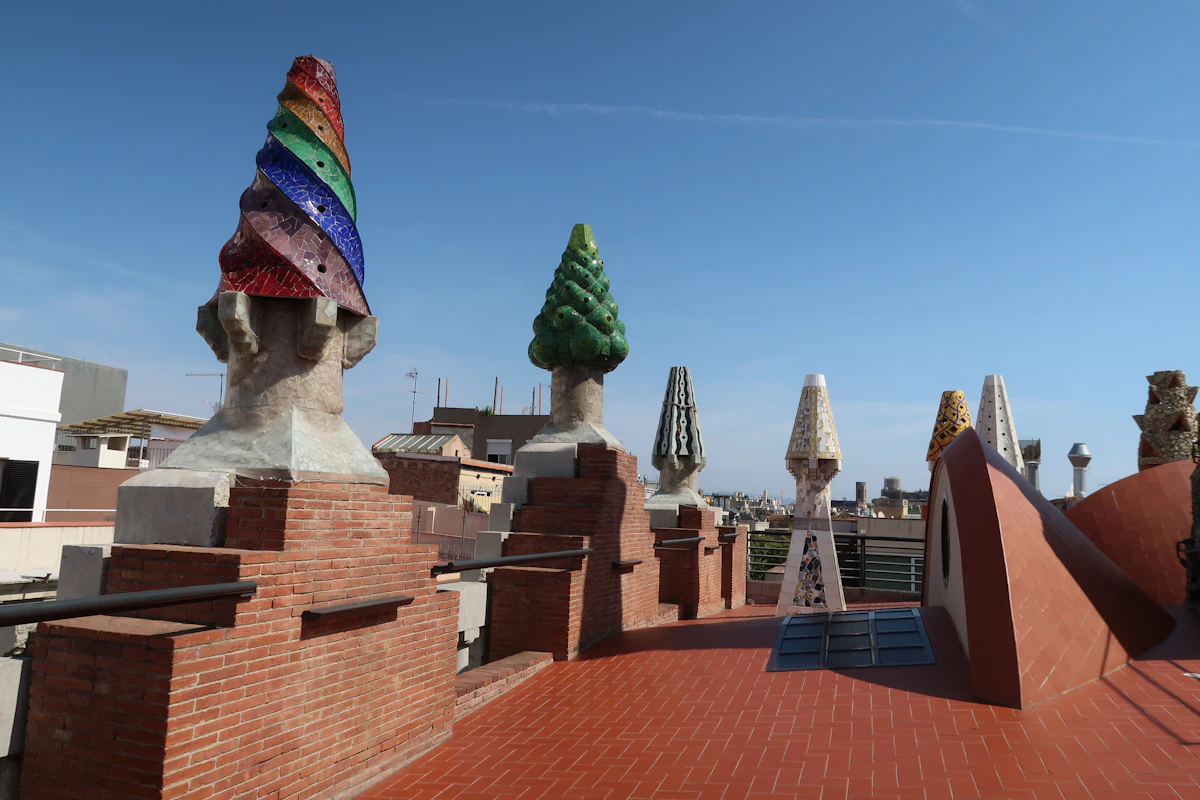 The colourful mosaic rooftop chimneys of Palau Güell in Barcelona, designed by Antoni Gaudí